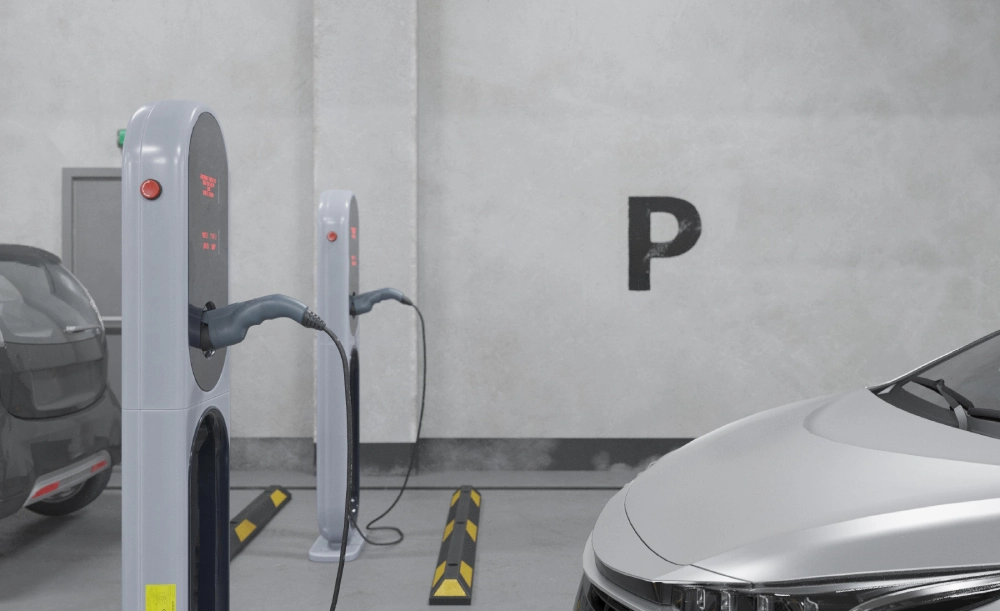 Designated EV charging zone in a residential basement parking lot, managed by proactive property facility management in Bangladesh.